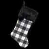STOCKING 20.5″ BLACK/ WHITE PLAID W/BLACK FAUX FUR CUFF AND POM POMS