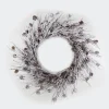 WREATH RATTAN 24″ FLOCKED W/ MIXED TWIGS & PINE CONES